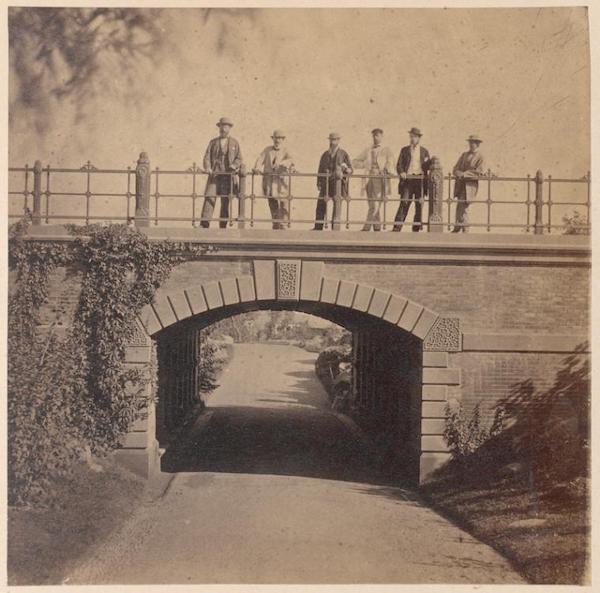 Men standing on Willowdell Arch