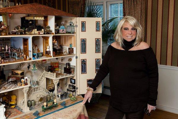 Collector Joanna Fisher with The Fisher Dollhouse
