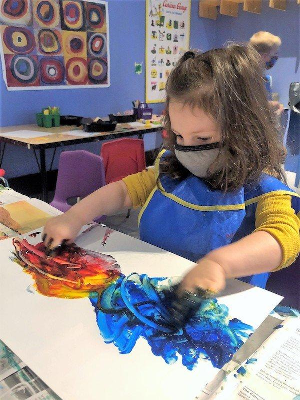 3s and 4s class child fingerpainting