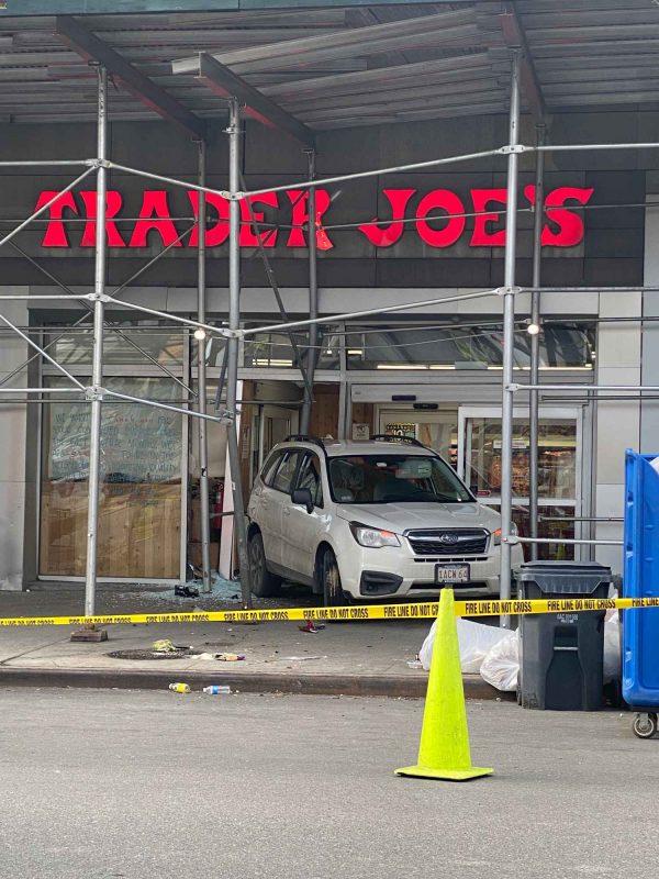 car drives into Trader Joe's