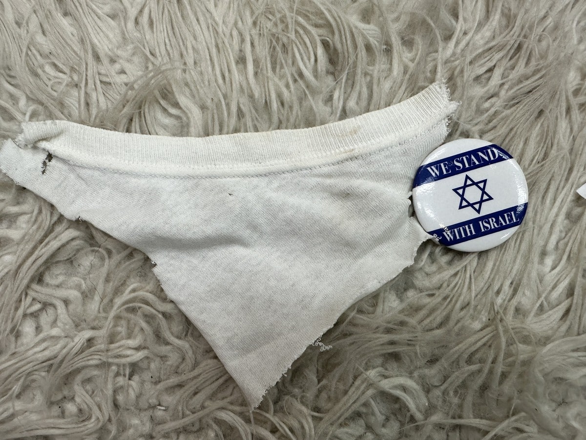 We Stand with Israel Pin that ripped off man shirt